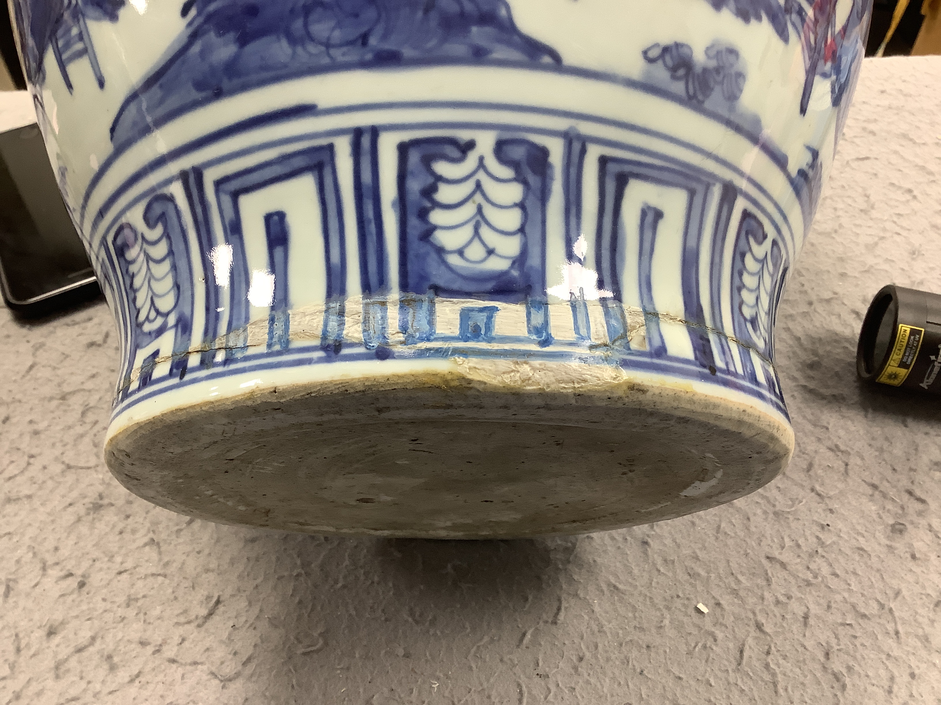 A Chinese Ming blue and white ‘scholars’ jar, guan, Wanli period (1572-1620), broken around base and restuck